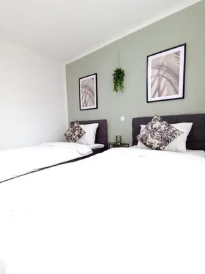 Ein Bett oder Betten in einem Zimmer der Unterkunft WAT Wohnung KL