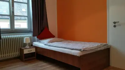 Ein Bett oder Betten in einem Zimmer der Unterkunft Pension Anna