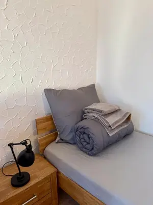 Ein Bett oder Betten in einem Zimmer der Unterkunft Boardinghouse Zur Rose