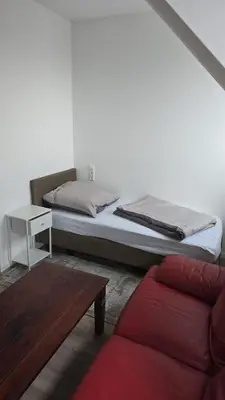 Ein Bett oder Betten in einem Zimmer der Unterkunft Gästehaus am Marktplatz