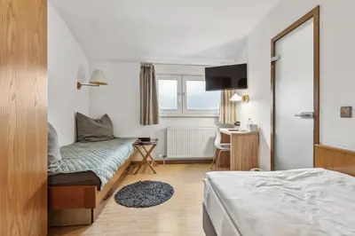 Ein Bett oder Betten in einem Zimmer der Unterkunft Hotel zum Erwin