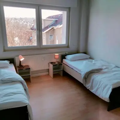 Ein Bett oder Betten in einem Zimmer der Unterkunft MZK Maier Schöne Aussicht, Preiswert