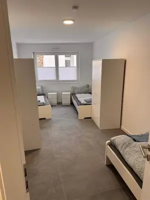 Ein Bett oder Betten in einem Zimmer der Unterkunft Moderne Wohnung für 4 Personen mit extra Schlafzimmer, Wohnzimmer & Balkon