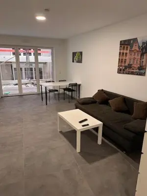 Ein Sitzbereich in der Unterkunft Moderne Wohnung für 4 Personen mit extra Schlafzimmer, Wohnzimmer & Balkon