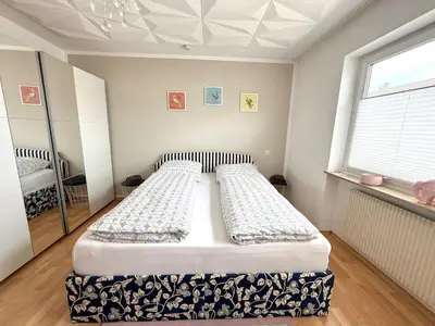 Ein Bett oder Betten in einem Zimmer der Unterkunft Gemütliche 2 Zimmer Wohnung in Kleinostheim