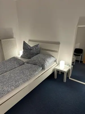 Ein Bett oder Betten in einem Zimmer der Unterkunft Sonnenlage - Ferienwohnung nahe Pforzheim-Karlsruhe - 7 Minuten zur A8