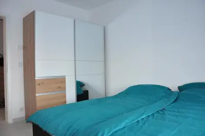Ein Bett oder Betten in einem Zimmer der Unterkunft Modern Apartment in B'heim EG Nr 2