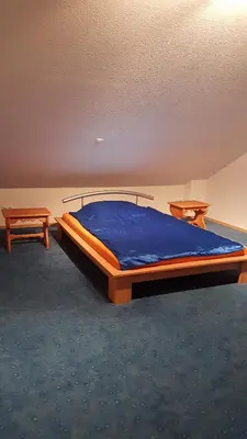 Ein Bett oder Betten in einem Zimmer der Unterkunft Römerland im Schwäbischen Wald mit 2 Schlafzimmern