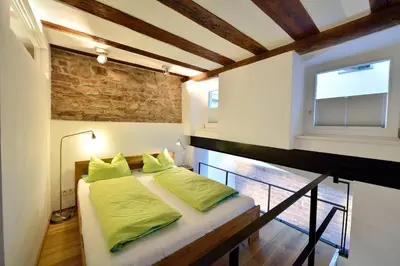 Ein Bett oder Betten in einem Zimmer der Unterkunft Altstadtapartment Remise