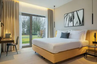 Ein Bett oder Betten in einem Zimmer der Unterkunft DAS AFFALTERBACH, Stuttgart, Autograph Collection