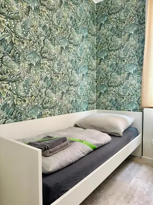 Ein Bett oder Betten in einem Zimmer der Unterkunft Neuwertiges Apartment mit schnellem WLAN, Glasfaser, R7