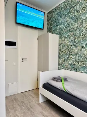 Ein Bett oder Betten in einem Zimmer der Unterkunft Neuwertiges Apartment mit schnellem WLAN, Glasfaser, R7