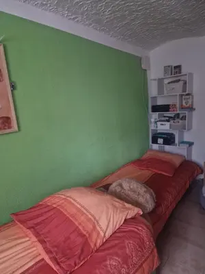 Ein Bett oder Betten in einem Zimmer der Unterkunft Ferienwohnung Zur Flomborner Wutz