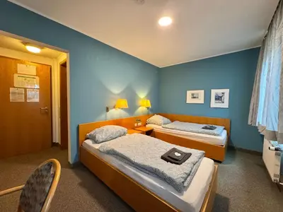 Ein Bett oder Betten in einem Zimmer der Unterkunft AR Airport Hotel Rüsselsheim
