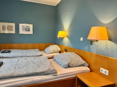 Ein Bett oder Betten in einem Zimmer der Unterkunft AR Airport Hotel Rüsselsheim