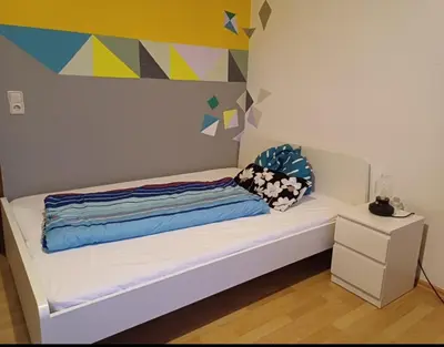 Ein Bett oder Betten in einem Zimmer der Unterkunft Appartement Farbenfroh