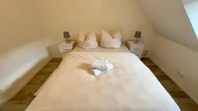 Ein Bett oder Betten in einem Zimmer der Unterkunft Design Penthouse im Schlossareal Deidesheim