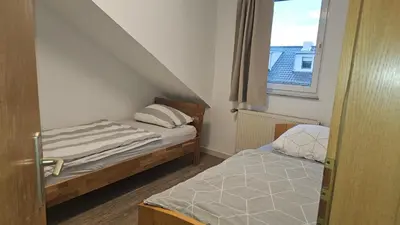 Ein Bett oder Betten in einem Zimmer der Unterkunft Komfortable Monteurwohnung auf Zeit