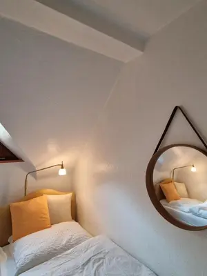 Ein Bett oder Betten in einem Zimmer der Unterkunft Waldquelle Vital Ferienwohnung