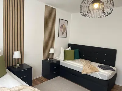 Ein Bett oder Betten in einem Zimmer der Unterkunft Charmantes Familienrefugium im Zentrum von Ludwigshafen - Eleganz & Komfort Ideal fur Familien