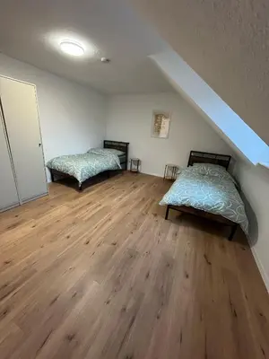 Ein Bett oder Betten in einem Zimmer der Unterkunft nJoy! Business Apartment Pforzheim - gratis WLAN