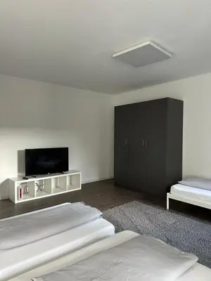 Ein Bett oder Betten in einem Zimmer der Unterkunft einladende Wohnung im Herzen von Sinsheim