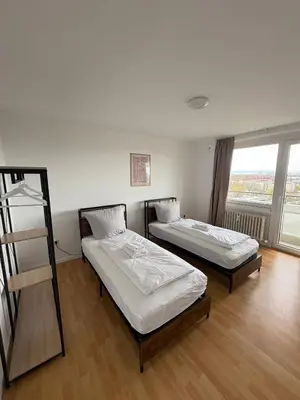 Ein Bett oder Betten in einem Zimmer der Unterkunft Monteurs Wohnung über den Dächern der Stadt