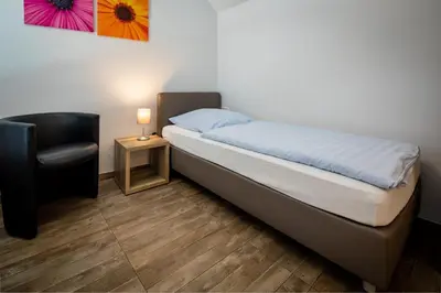Ein Bett oder Betten in einem Zimmer der Unterkunft Hotel Adler Kornwestheim