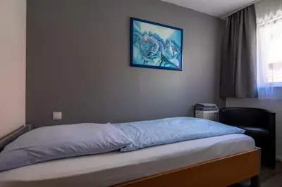 Ein Bett oder Betten in einem Zimmer der Unterkunft Hotel Adler Kornwestheim