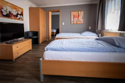 Ein Bett oder Betten in einem Zimmer der Unterkunft Hotel Adler Kornwestheim