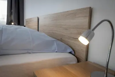 Ein Bett oder Betten in einem Zimmer der Unterkunft Hotel Adler Kornwestheim