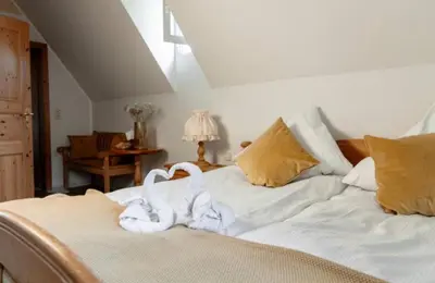 Ein Bett oder Betten in einem Zimmer der Unterkunft Landgasthaus Zum Engel