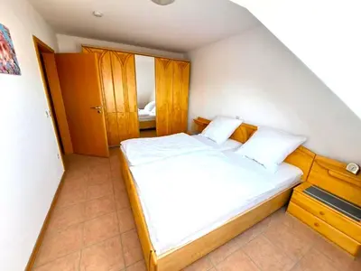 Ein Bett oder Betten in einem Zimmer der Unterkunft Ferienwohnung Schwab
