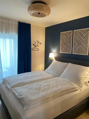 Ein Bett oder Betten in einem Zimmer der Unterkunft Marktplatz-Suite