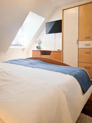 Ein Bett oder Betten in einem Zimmer der Unterkunft Gemütliche Ferienwohnung bei der neuen Messe Karlsruhe