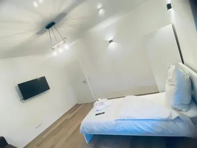 Ein Bett oder Betten in einem Zimmer der Unterkunft Rhein-Neckar-Apartments Viernheim