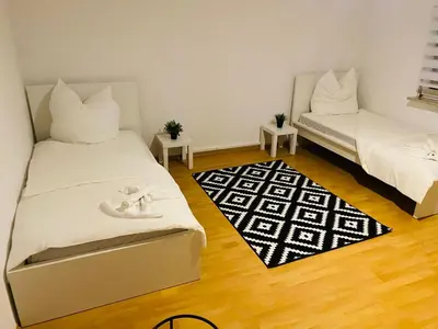 Ein Bett oder Betten in einem Zimmer der Unterkunft Rhein-Neckar-Apartments Viernheim