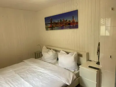 Ein Bett oder Betten in einem Zimmer der Unterkunft Mini Bungalow Zimmer 1