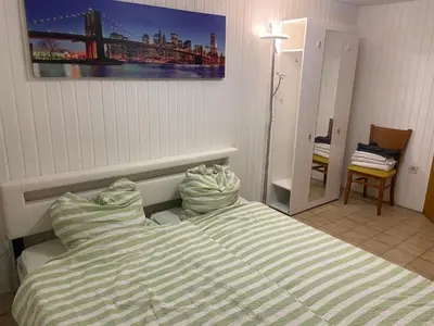 Ein Bett oder Betten in einem Zimmer der Unterkunft Mini Bungalow Zimmer 1