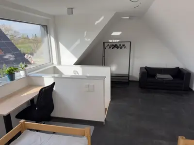 Ein Sitzbereich in der Unterkunft Moderne Maisonette-Wohnung