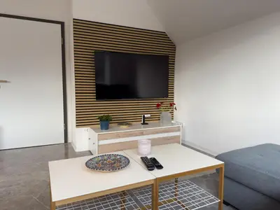 TV/Unterhaltungsangebot in der Unterkunft Moderne Maisonette-Wohnung