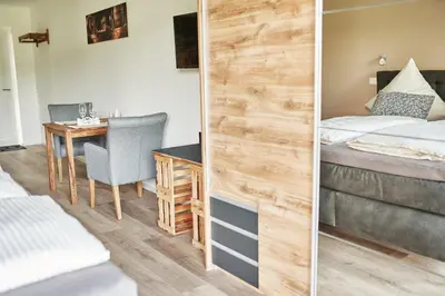 Ein Bett oder Betten in einem Zimmer der Unterkunft Weißwein Apartment