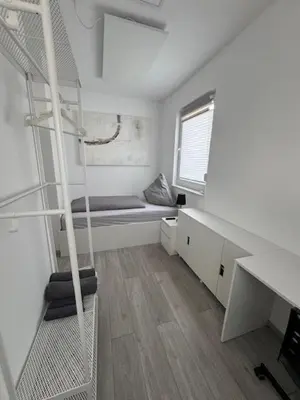 Ein Bett oder Betten in einem Zimmer der Unterkunft Hostel Kornwestheim
