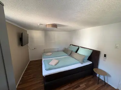 Ein Bett oder Betten in einem Zimmer der Unterkunft Ferienwohnung Neckarperle