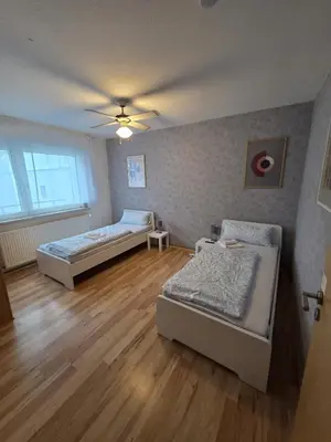 Ein Bett oder Betten in einem Zimmer der Unterkunft Apartment mit Wintergarten - Knielingen Industriepark