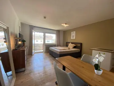 Ein Bett oder Betten in einem Zimmer der Unterkunft 1-Zimmerwohnung mit Balkon