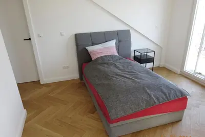 Ein Bett oder Betten in einem Zimmer der Unterkunft Ferienwohnung Rebenzauber Deidesheim