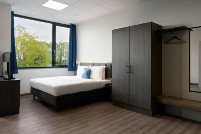 Ein Bett oder Betten in einem Zimmer der Unterkunft Four Points Flex by Sheraton Östringen
