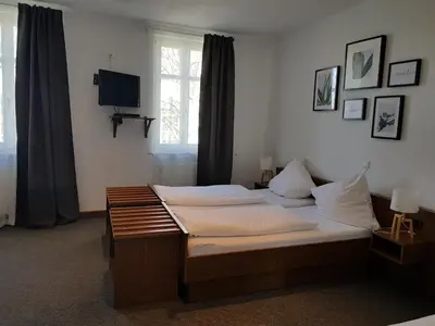 Ein Bett oder Betten in einem Zimmer der Unterkunft Gasthaus Zum Ochsen