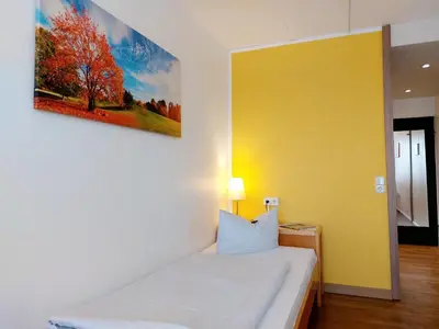 Ein Bett oder Betten in einem Zimmer der Unterkunft Heinrich Pesch Hotel